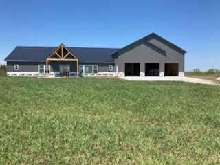 Finished barndominium-style home with attached garage